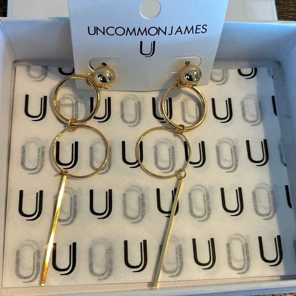 Baller Earrings woman’s Gold tone new in box.